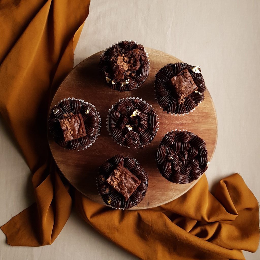 Double chocolate cupcakes with double chocolate buttercream and double chocolate brownie toppings 
